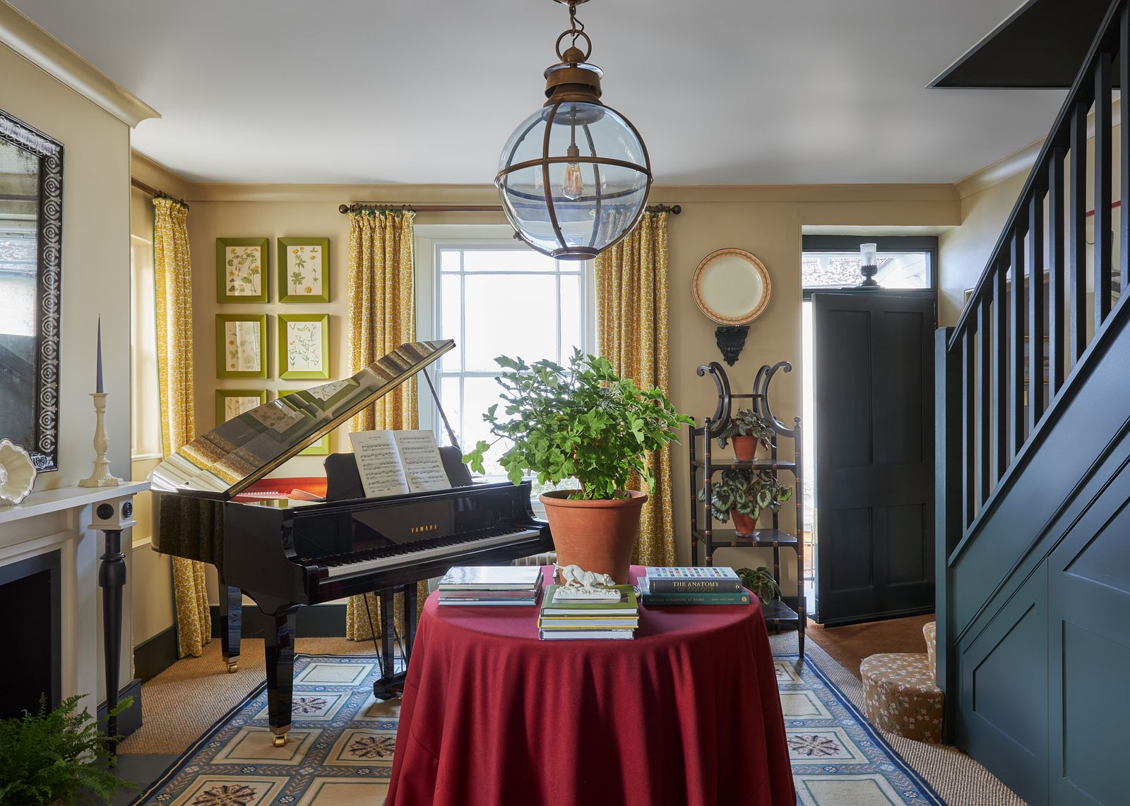 Image may contain Book Publication Keyboard Musical Instrument Piano Lamp Plant Desk Furniture Table and Indoors