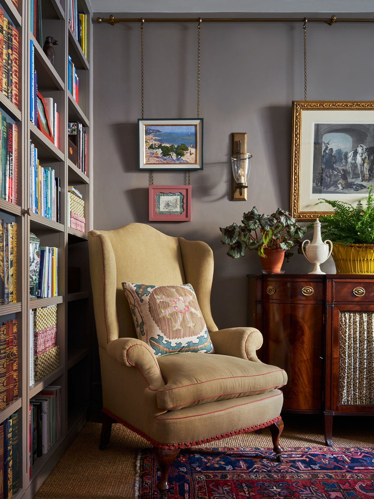 Image may contain Furniture Plant Art Painting Chair Home Decor Rug and Bookcase