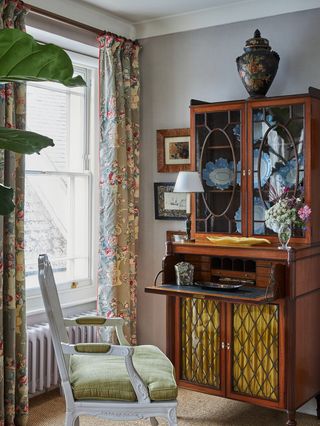 Image may contain Chair Furniture Indoors Interior Design Lamp Art Painting Cabinet Architecture and Building