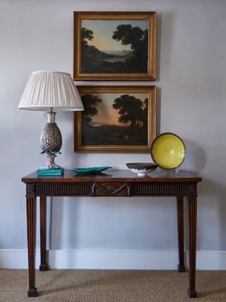 Image may contain Lamp Furniture Table Table Lamp Art Painting Desk and Plate