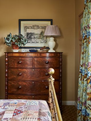 Image may contain Lamp Plant Furniture Cabinet Art Painting Drawer Indoors Interior Design Bed Animal and Horse