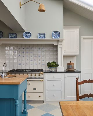 Image may contain Indoors Interior Design Kitchen Chair Furniture Sink Sink Faucet Plate Plant and Cooktop