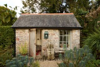 Image may contain Architecture Building Cottage House Housing Plant Countryside Hut Nature Outdoors and Rural